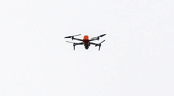 N illegal drone is seen flying in the sky as Britain's King Charles III and Britain's Camilla, Queen Consort travel in the Diamond State Coach, in...