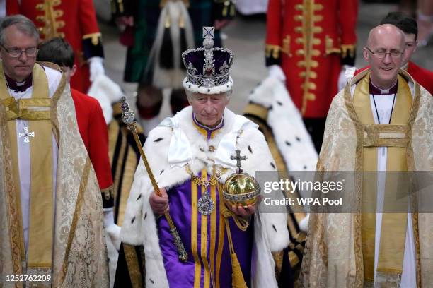 King Charles III walks in the Coronation Procession after his coronation ceremony at Westminster Abbey on May 6, 2023 in London, England. The...