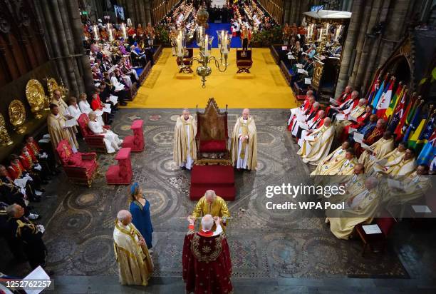 King Charles III is handed the Sword of State during his coronation ceremony in Westminster Abbey on May 6, 2023 in London, England. The Coronation...