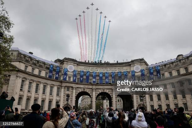 The British Royal Air Force's aerobatic team, the "Red Arrows", perform a fly-past over Admiralty Arch in central London on May 6 after the...