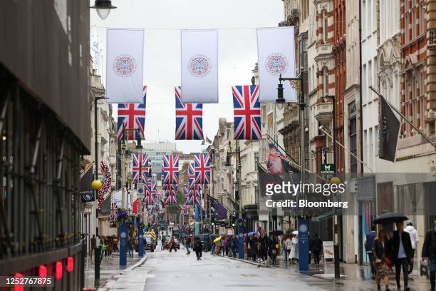 Shoppers walk along New Bond Street, on the day of the coronation of King Charles III, in London, UK, on Saturday, May 6, 2023. The event is expected...