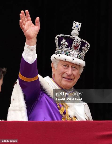 King Charles III waves as he leaves the balcony of Buckingham Palace following the coronation on May 06, 2023 in London, England. The Coronation of...