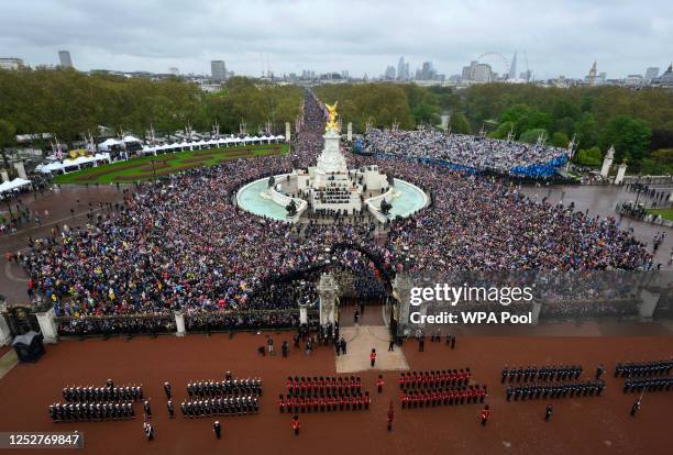 Crowds gather on The mall outside Buckingham Palace following the coronation of King Charles III and Queen Camilla on May 06, 2023 in London,...