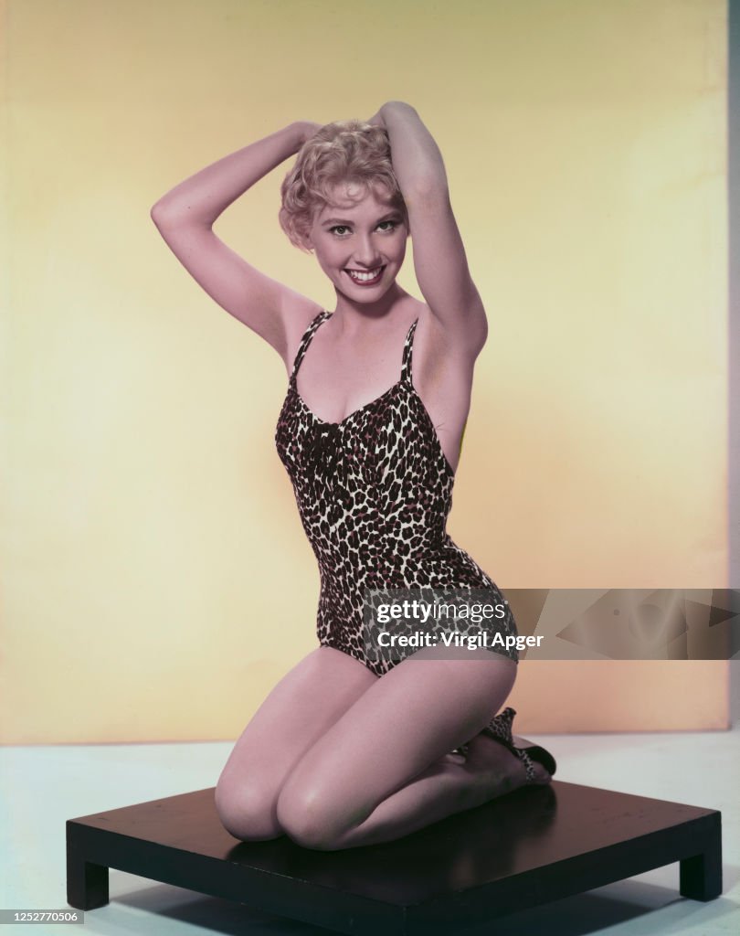 American actress Elinor Donahue wearing a leopard print swimsuit