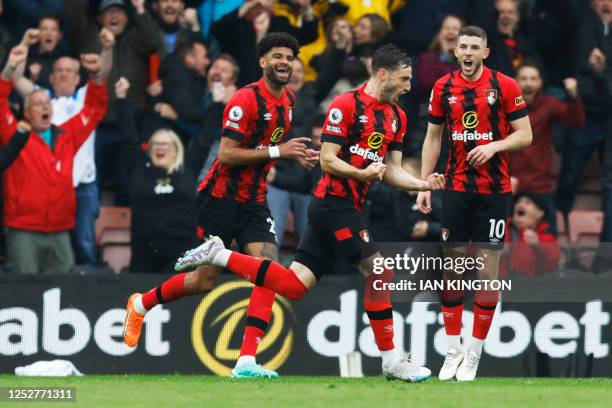 Bournemouth's Uruguayan defender Matias Vina celebrates with teammates after scoring his team's first goal during the English Premier League football...