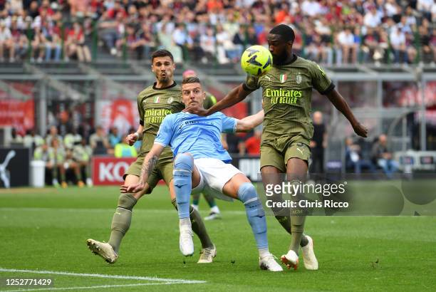 Sergej Milinkovic-Savic of SS Lazio battles for the ball with Fikayo Tomori of AC Milan during the Serie A match between AC Milan and SS Lazio at...