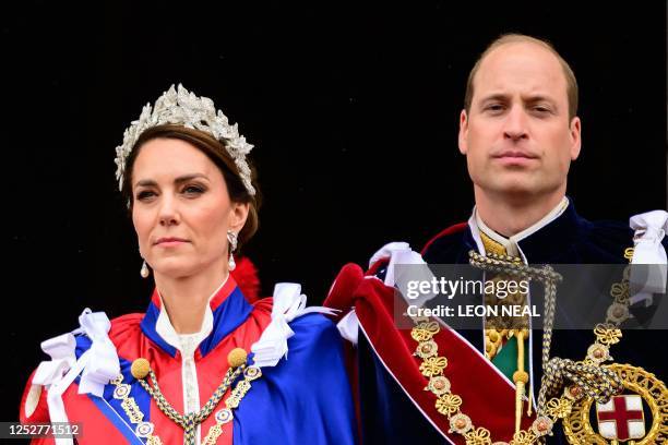 Britain's Catherine, Princess of Wales and Britain's Prince William, Prince of Wales stand on the Buckingham Palace balcony, in London, following the...