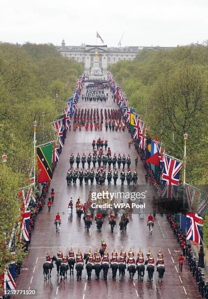 The Coronation Procession travels along The Mall following the coronation ceremony of King Charles III and Queen Camilla on May 6, 2023 in London,...