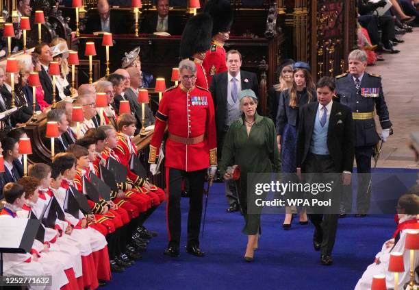 Laura and Harry Lopes and Tom Parker Bowles attending the coronation ceremony of King Charles III and Queen Camilla in Westminster Abbey, on May 6,...