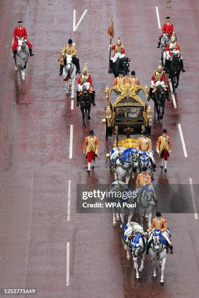 The Diamond Jubilee State Coach, accompanied by the Sovereign's Escort of the Household Cavalry, travels along The Mall in the King's Procession...