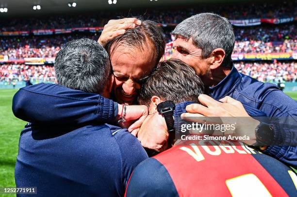 Alberto Gilardino head coach of Genoa celebrates with Alessandro Vogliacco and his staff after Genoa have earned promotion in the Serie B match...