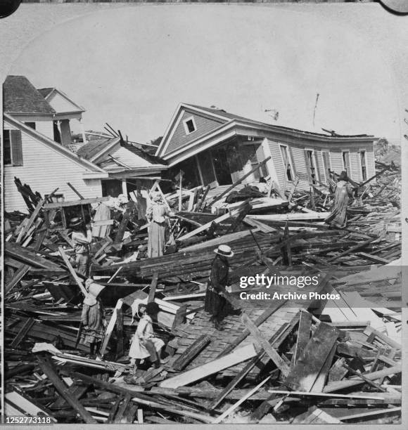 People searching the wreckage for their belongings a few days after the 1900 Galveston hurricane in Texas.