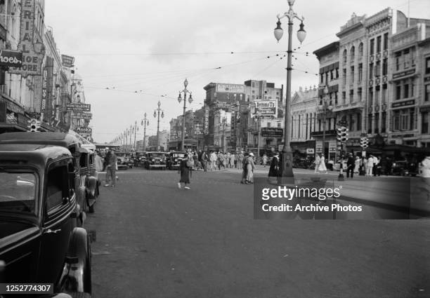 Canal Street in New Orleans, Louisiana, near the junction with Bourbon Street, 1936.
