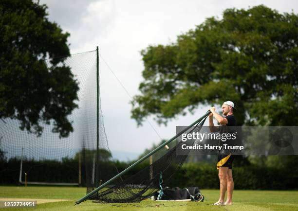 Elliott Trotman of Blagdon Hill prepares to set up the net during a net session at Blagdon Hill Cricket Club on June 26, 2020 in Taunton, England....