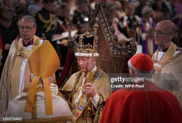 King Charles III, wearing St Edward's Crown, during his coronation ceremony in Westminster Abbey on May 6, 2023 in London, England. The Coronation of...