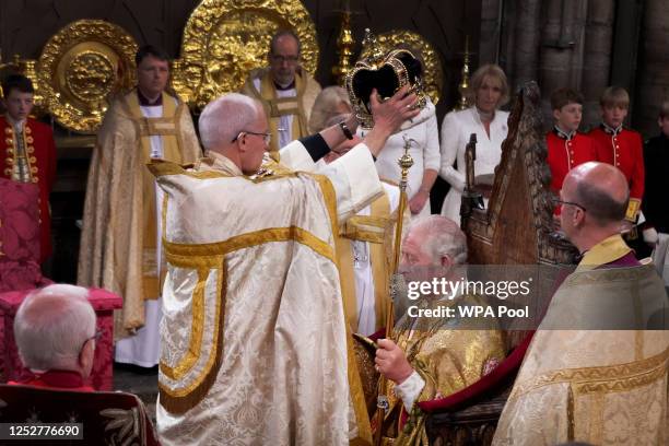 King Charles III is crowned with St Edward's Crown by The Archbishop of Canterbury the Most Reverend Justin Welby during his coronation ceremony in...