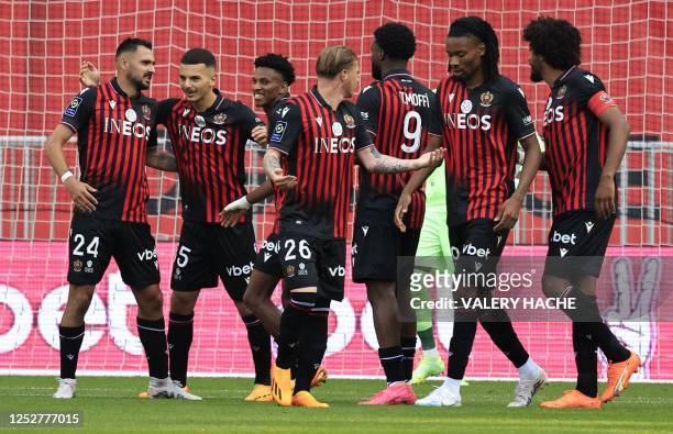 Nice's French forward Gaetan Laborde celebrates with teammates after scoring a goal during the French L1 football match between OGC Nice and FC...