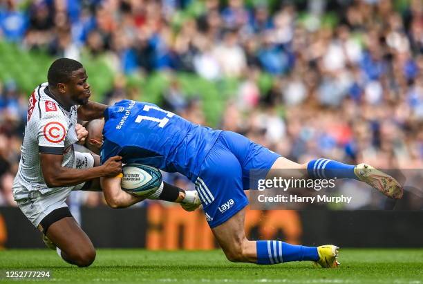 Dublin , Ireland - 6 May 2023; Dave Kearney of Leinster is tackled by Aphelele Fassi of Cell C Sharks during the United Rugby Championship...