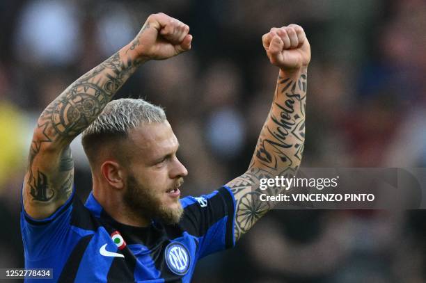 Inter Milan's Italian defender Federico Dimarco celebrates after opening the scoring during the Italian Serie A football match between AS Rome and...