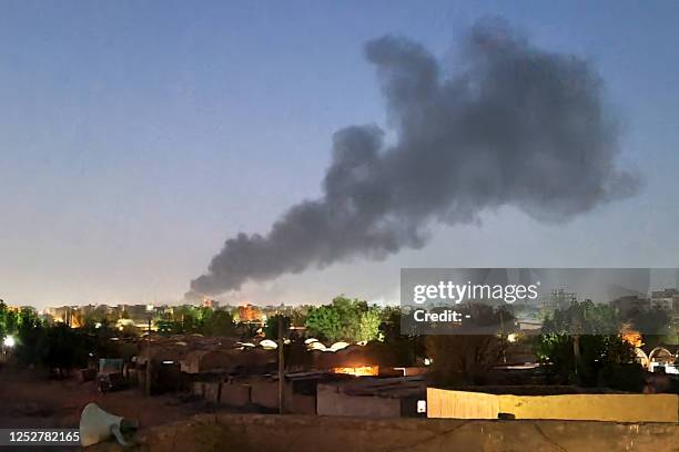 Smoke billows in Khartoum amid ongoing fighting between the forces of two rival generals in Sudan on May 6, 2023. - Air strikes battered Sudan's...