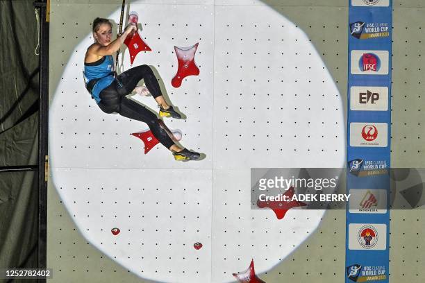 Polish speed climber Aleksandra Miroslaw gestures as she competes in the Women's qualifying speed discipline at the IFSC Climbing World Cup Jakarta...