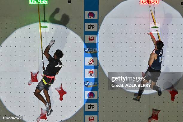 France's speed climber Bassa Mawem and South Korean's Lee Yongsu compete in the Men's qualifying speed discipline at the IFSC Climbing World Cup...