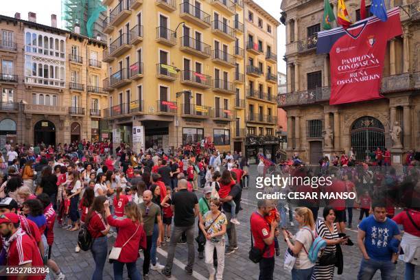 Osasuna's supporters gather in front of giant Osasuna's jersey hanging on the facade of Pamplona City Hall before the Spanish Copa del Rey final...