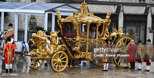 King Charles lll and Queen Camilla depart Westminster Abbey in the Gold State Coach following their coronation at Westminster Abbey on May 06, 2023...