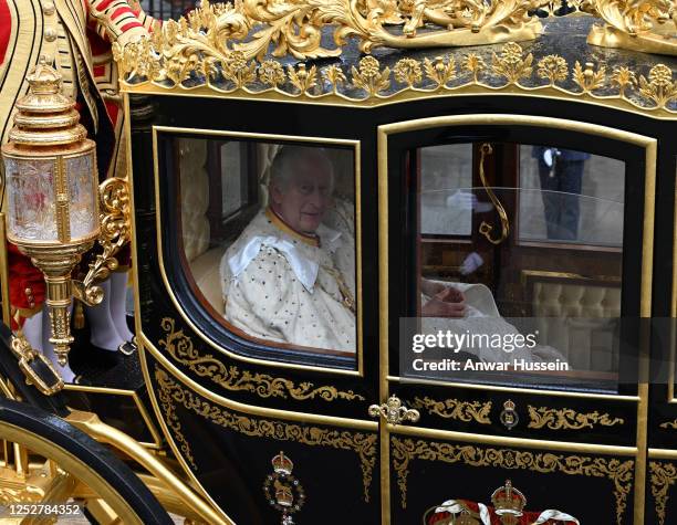 King Charles lll and Queen Camilla arrive at Westminster Abbey in the Diamond Jubilee Coach to attend their coronation on May 06, 2023 in London,...