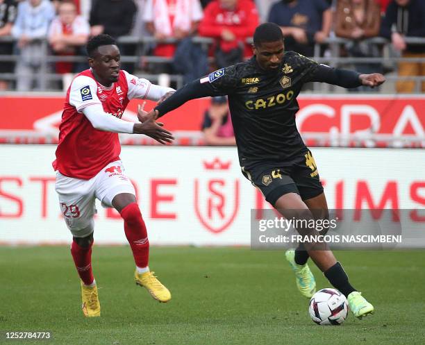 Lille's Brazilian defender Alexsandro fights for the ball with Reims' English forward Folarin Balogun during the French L1 football match between...