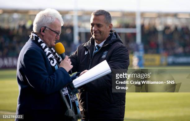 Hugh Dan Maclennan and Warriors' head coach Franco Smith during a BKT United Rugby Championship match between Glasgow Warriors and Munster at...