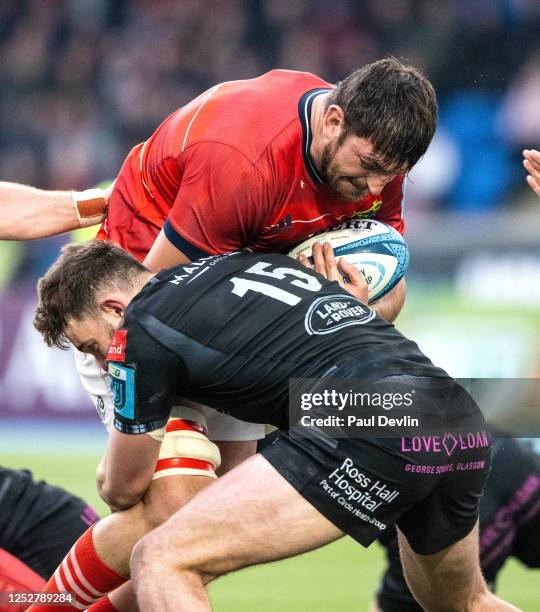 Scotland , United Kingdom - 6 May 2023; Jean Kleyn of Munster is tackled by Ollie Smith of Glasgow Warriors during the United Rugby Championship...