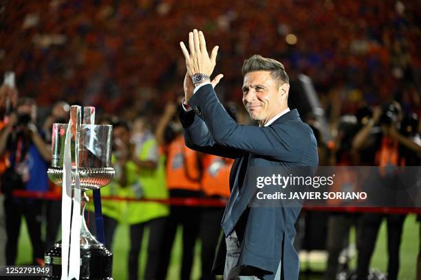 Real Betis' Spanish midfielder and captain Joaquin applauds next to the trophy prior the Spanish Copa del Rey final football match between Real...