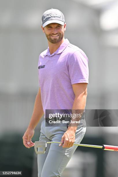 Wyndham Clark smiles while walking onto the second green during the third round of the Wells Fargo Championship at Quail Hollow Club on May 6, 2023...