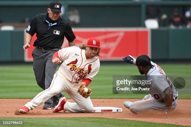 Akil Baddoo of the Detroit Tigers slides into second base ahead of the tag from Brendan Donovan of the St. Louis Cardinals in the fifth inning of the...
