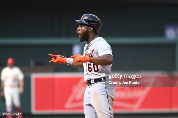 Akil Baddoo of the Detroit Tigers reacts after hitting a ground rule double, resulting in a run against the St. Louis Cardinals, in the tenth inning...