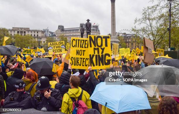 Protesters hold 'Not my king' and 'Citizen not subject' placards during the demonstration. Anti-monarchists staged a protest in Trafalgar Square...