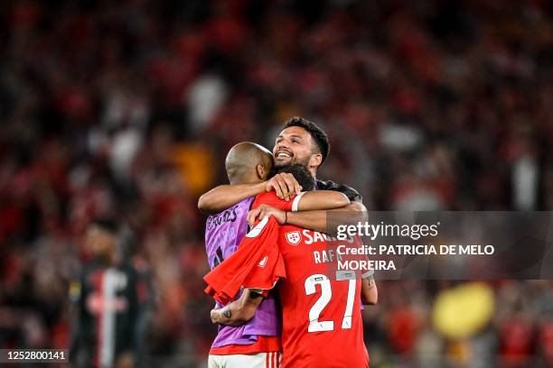 Benfica's Portuguese forward Goncalo Ramos , Benfica's Portguese forward Rafa Silva and Benfica's Portuguese midfielder Joao Mario celebrate victory...