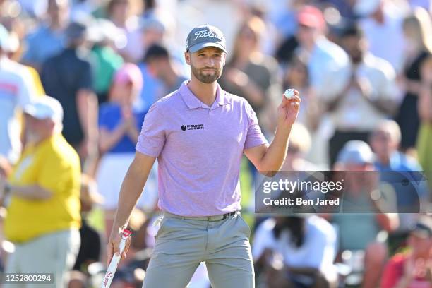 Wyndham Clark waves his ball on the 18th green during the third round of the Wells Fargo Championship at Quail Hollow Club on May 6, 2023 in...
