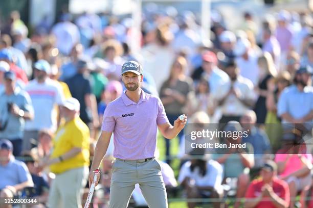 Wyndham Clark waves his ball on the 18th green during the third round of the Wells Fargo Championship at Quail Hollow Club on May 6, 2023 in...