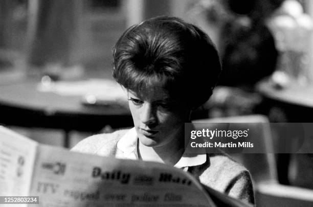 English actress Maggie Smith as Sarah Watkins reads the Daily Mail while on the set of the film 'The Honey Pot' circa 1966 at Cinecitta Studios in...
