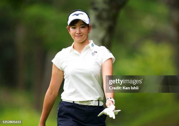 Erika Hara of Japan smiles on her way to the 3rd tee during the third round of the Earth Mondamin Cup at the Camellia Hills Country Club on June 27,...