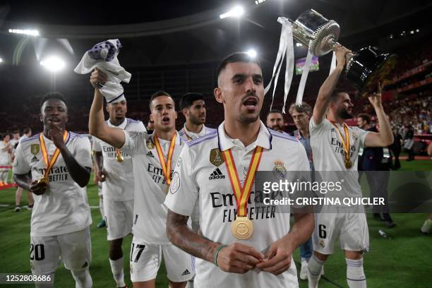 Real Madrid's Spanish midfielder Dani Ceballos and teammates celebrate with the trophy after winning the Spanish Copa del Rey final football match...