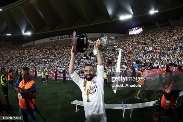 Dani Carvajal of Real Madrid lifts the trophy after winning the Copa del Rey final soccer match between Real Madrid and Osasuna at the La Cartuja...