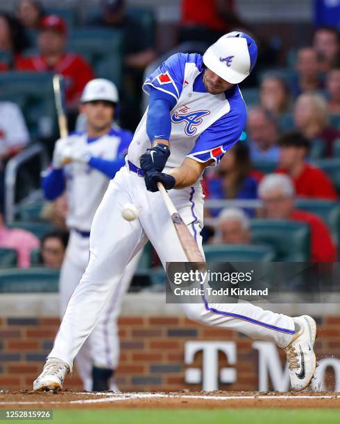 Matt Olson of the Atlanta Braves hits a single during the fourth inning against the Baltimore Orioles at Truist Park on May 6, 2023 in Atlanta,...