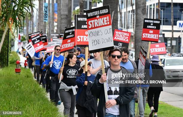 Writer Eric Heisserer hold his sign on the picket line on the fourth day of the strike by the Writers Guild of America in front of Netflix in...