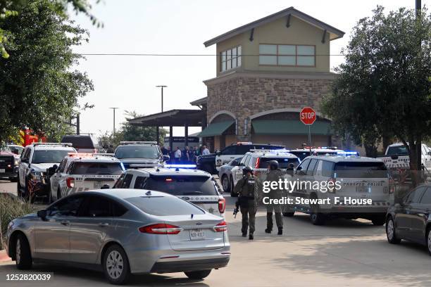 Emergency personnel work the scene of a shooting at Allen Premium Outlets on May 6, 2023 in Allen, Texas. According to reports, a shooter opened fire...