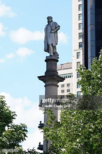 View of the marble statue of Christopher Columbus atop the Columbus Monument created by Italian sculptor Gaetano Russoon located at the center of...