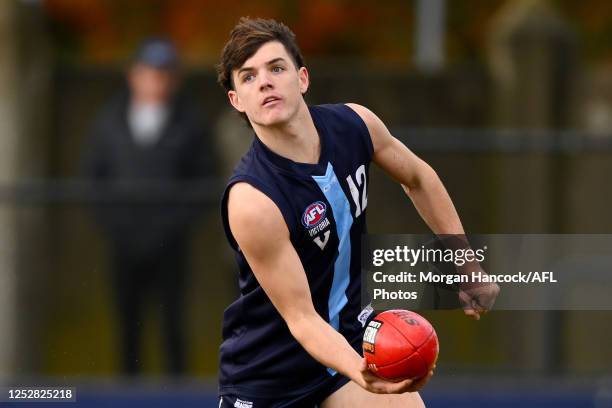 Archie Roberts of Vic Metro handballs during the match between the Young Guns and Vic Metro at Trevor Barker Beach Oval on May 07, 2023 in Melbourne,...