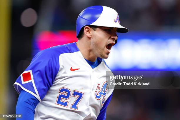 Austin Riley of the Atlanta Braves reacts as he rounds third on his way to score following a Kevin Pillar home run during the eighth inning against...